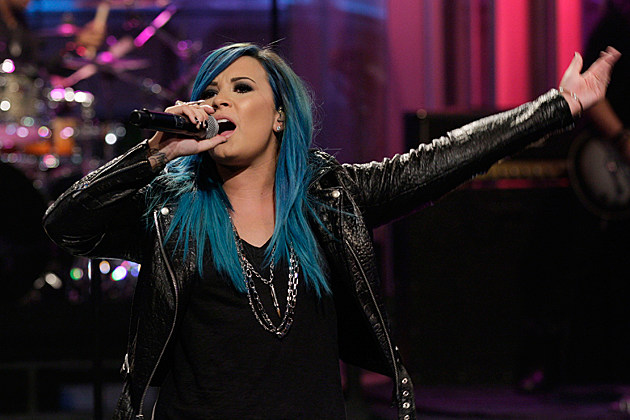 demi-lovato-blue-hair THE TONIGHT SHOW WITH JAY LENO -- Episode 4541-- Pictured: Musical guest Demi Lovato performs on October 2, 2013 -- (Photo by: Stacie McChesney/NBC/NBCU Photo Bank via Getty Images)